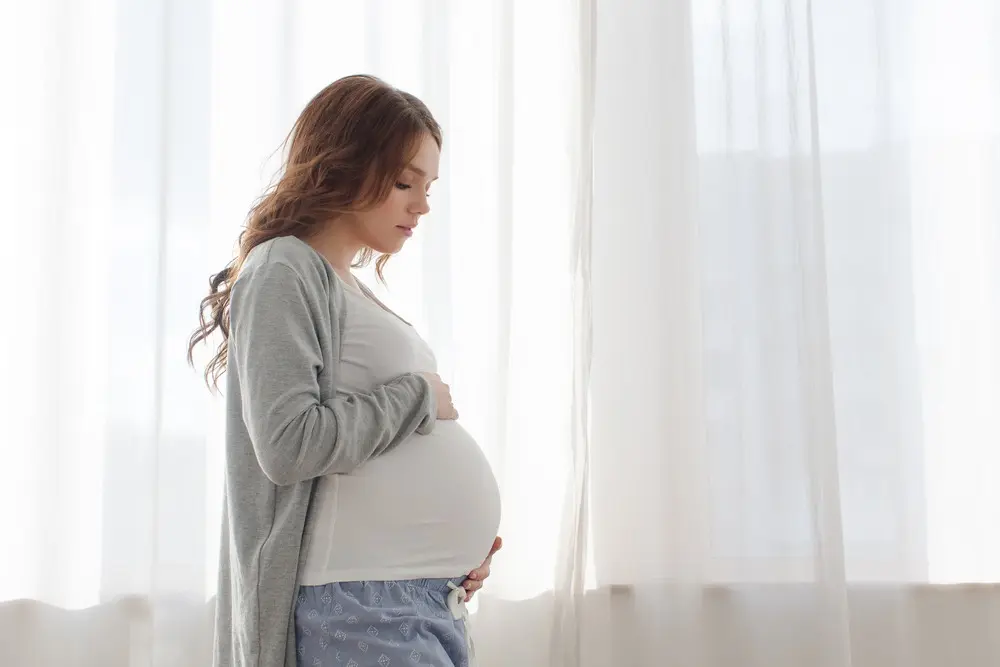 pregnant woman touching her belly in Florida 