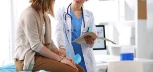 woman consoling patient