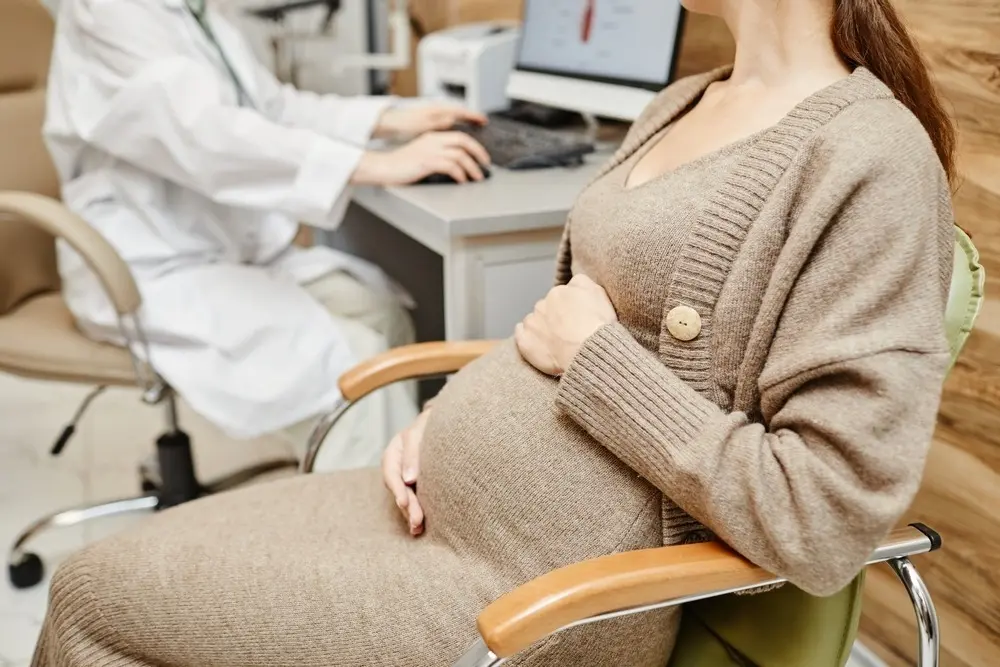 pregnant woman with doctor.