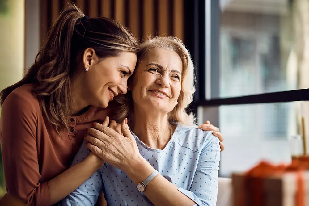 woman hugging her elderly mother