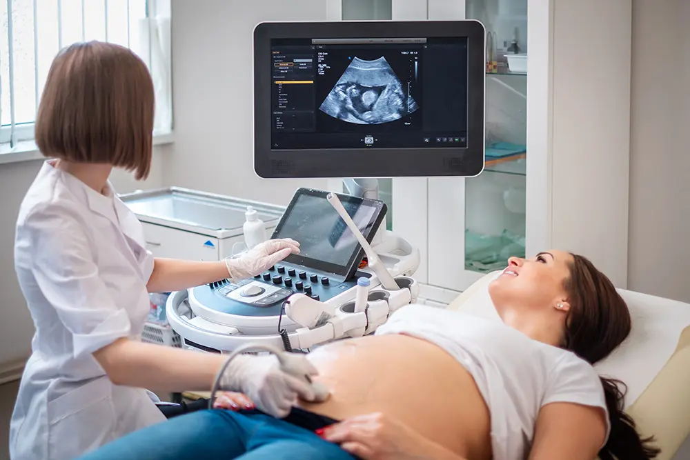 pregnant woman receiving an ultrasound